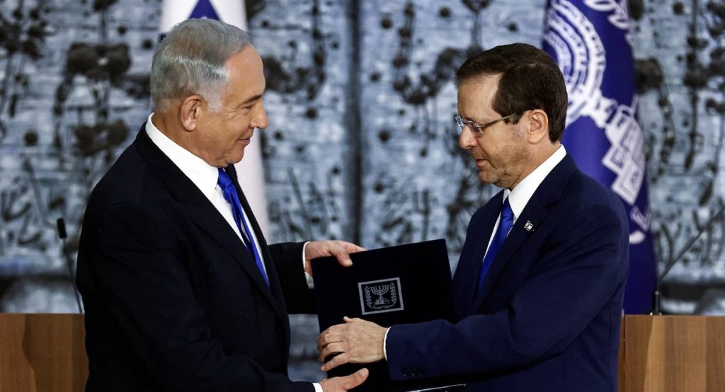 Israel President Isaac Herzog hands Benjamin Netanyahu the mandate to form a new government. Photo credit: REUTERS/Ronen Zvulun