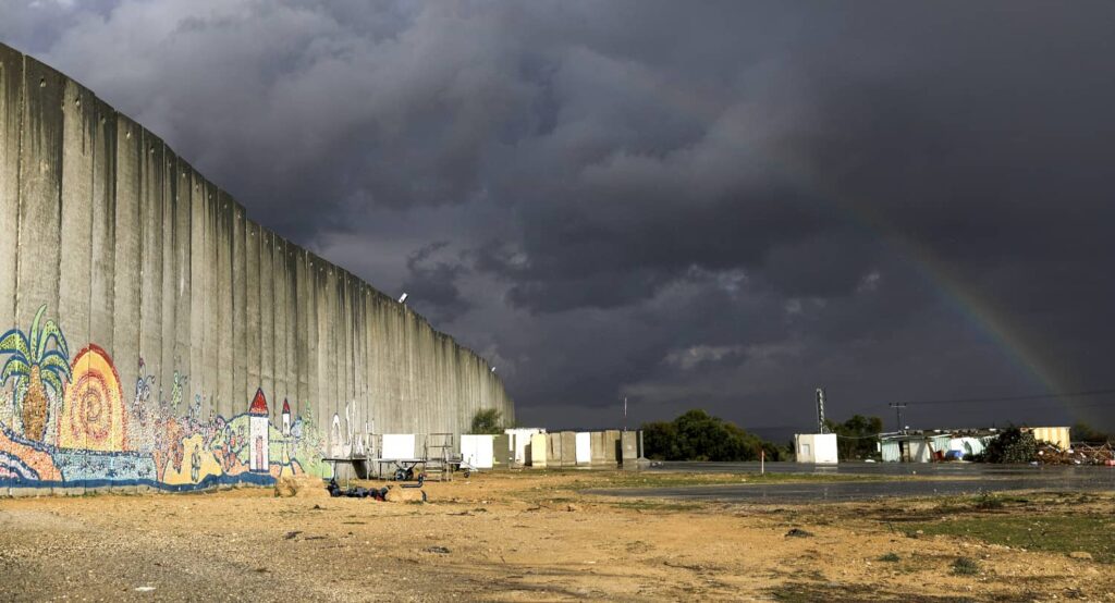 A rainbow over the border wall in the northern Gaza Strip, near Netiv HaAsara, Israel. Photo credit: REUTERS/Amir Cohen