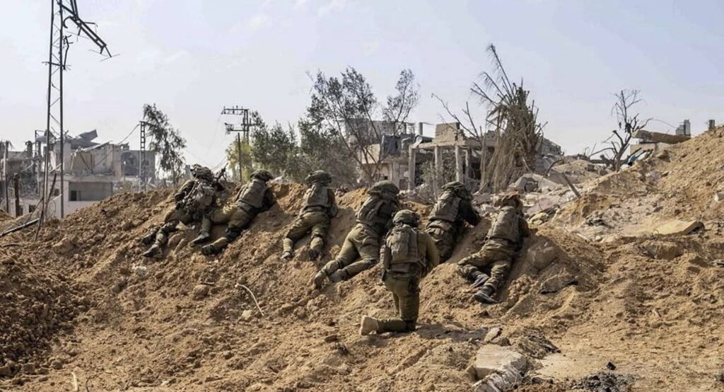 IDF soldiers take position in the Gaza Strip, November 4, 2023. Photo credit: Israel Defense Forces/Handout via REUTERS.