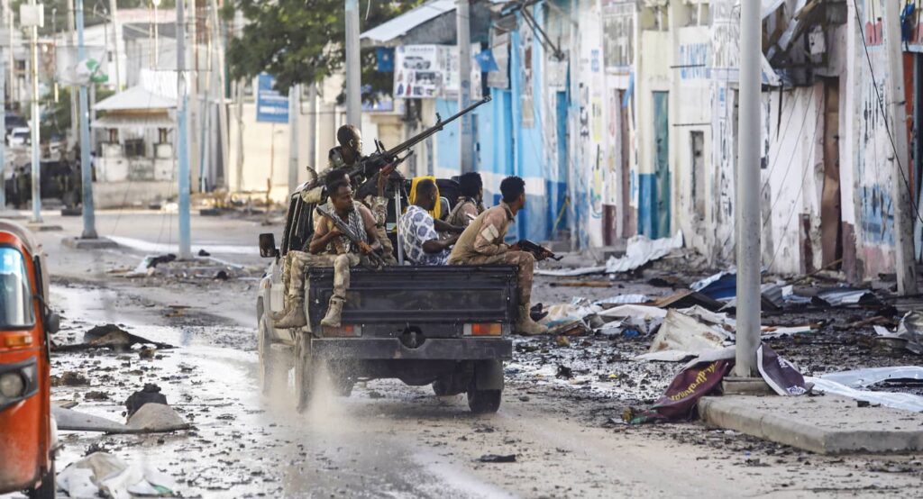 Somali security officers drive past a scene of an al-Shabaab attack in Mogadishu, Somalia, August 20, 2022. Photo credit: REUTERS/Feisal Omar.