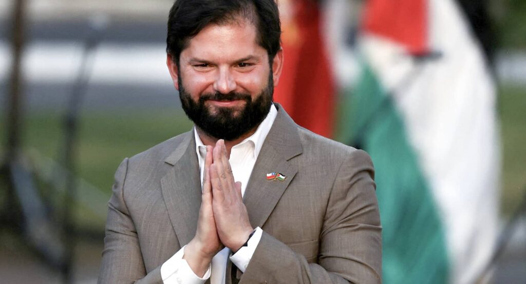 Chile's President Gabriel Boric greets members of the Palestinian community in Chile at a ceremony called 'From Belen (Bethlehem) to Chile' during the Christmas season, December 20, 2023. Photo credit: REUTERS/Ivan Alvarado.